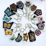 White Cat Paw on Black Embroidery Kit: DIY Keychain, Leatherette Base
